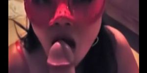 Masked Asian chick sucks penis clean