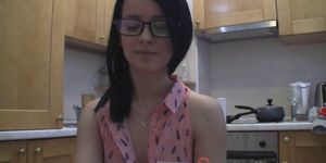 Splendid teen with glasses chatting in the kitchen